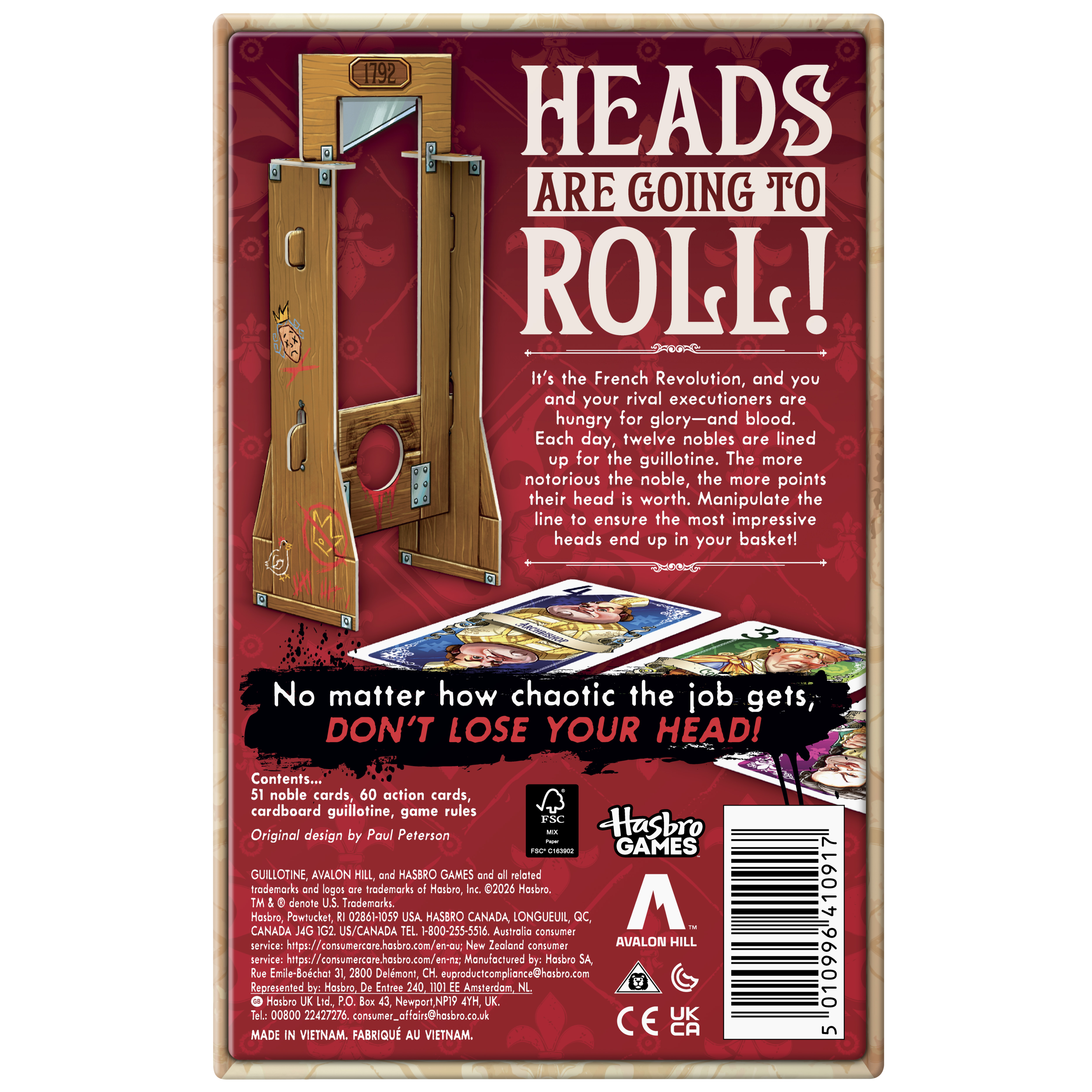 Guillotine box, cards, and prop on a plain background