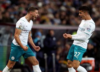 Ruben Dias (left) and Joao Cancelo (right) are among the players missing for City this week
