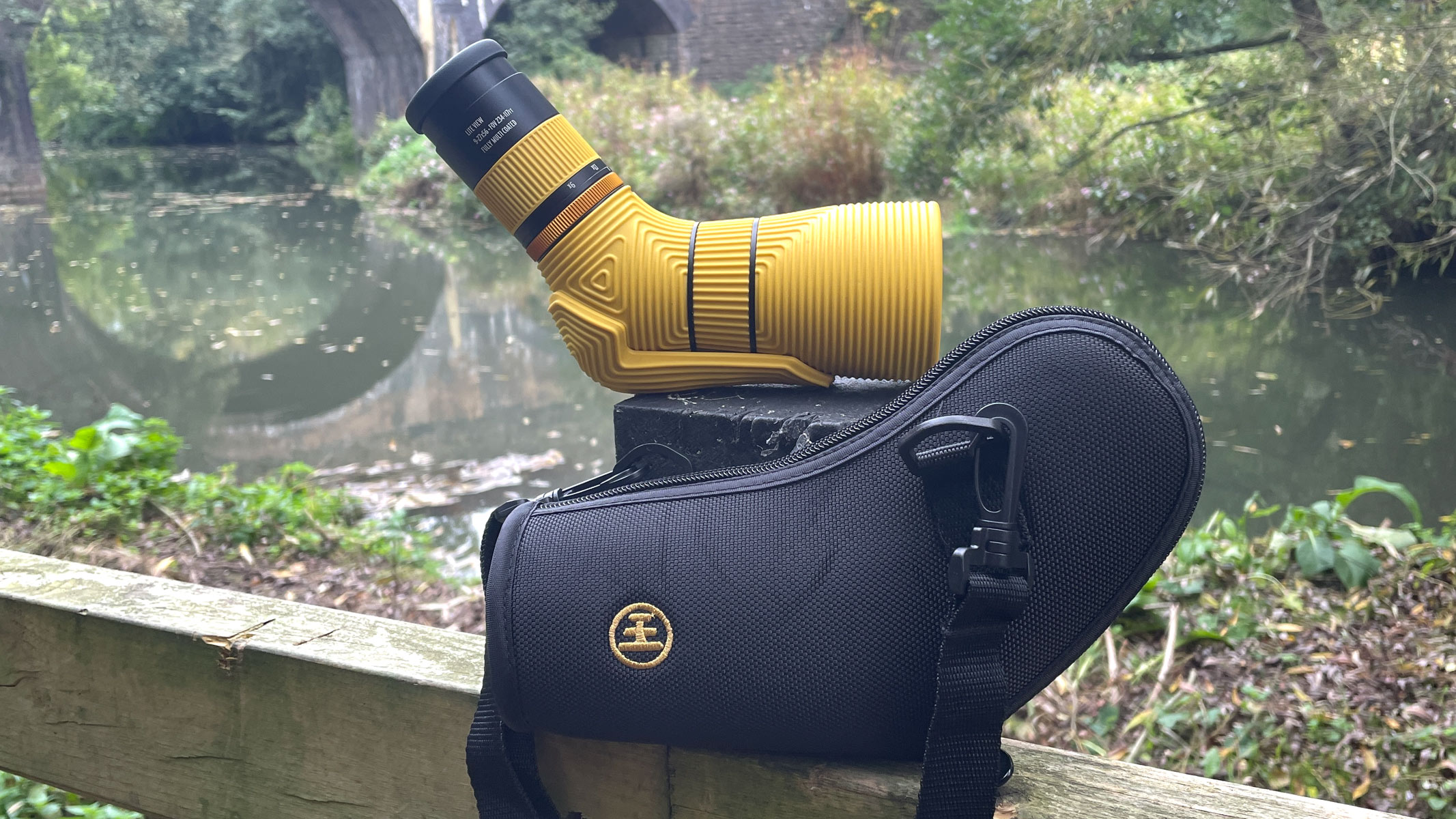The Nocs Provisions Lite View spotting scope with carry case next to a river.