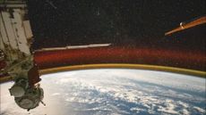 This high-exposure photo from the International Space Station shows Earth's atmospheric glow and a starry sky as the orbital complex soared 258 miles (415 kilometers) above the Pacific Ocean northeast of Papua New Guinea.