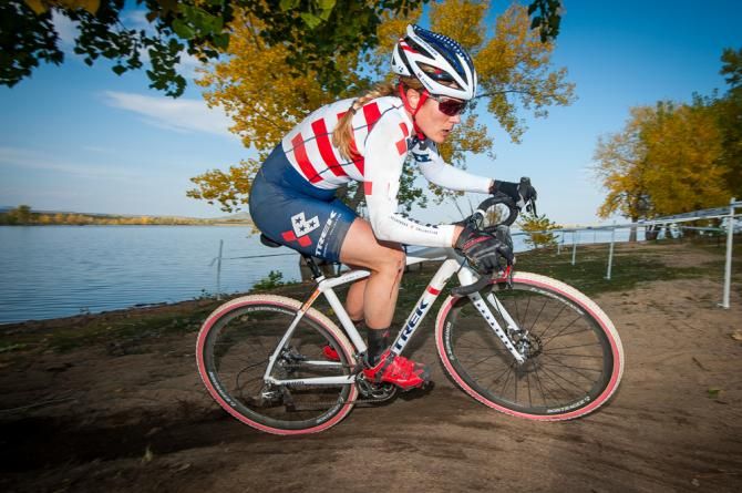 Katie Compton (Trek) rides into the sunset alone and away from the rest of the race while along the sandy shores of Boulder Reservoir. Colorado Cross Classic.