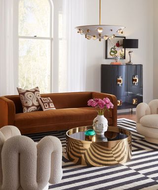 Living room with retro furniture and geometric pillows and rug