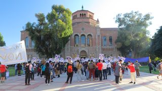 Picketers rally in front of the UCLA library.