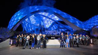 Bruce Boxleitner, Cindy Morgan, Mickey Minnie and others in front of Tron: Lightcycle Run