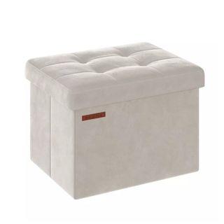 A square white storage ottoman with a tufted top
