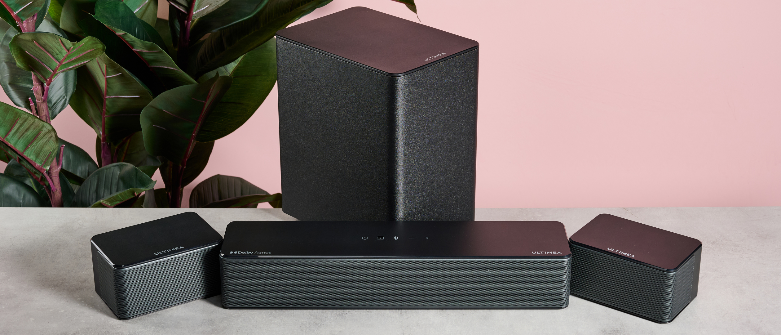 Ultimea Poseidon D60 system together on table in front of plant