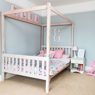 children bedroom with four poster bed
