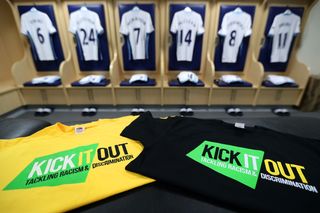 Premier League dressing room with Kick It Out t-shirts laid out