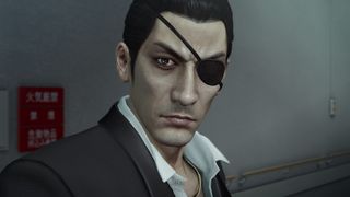 Goro Majima facing the camera with a serious expressions on his face