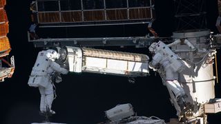 NASA astronaut Shane Kimbrough and ESA astronaut Thomas Pesquet carry a new solar array for the International Space Station in a June 6, 2021 spacewalk.