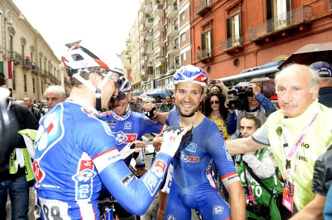 Nacer Bouhanni is congratulated by his teammates