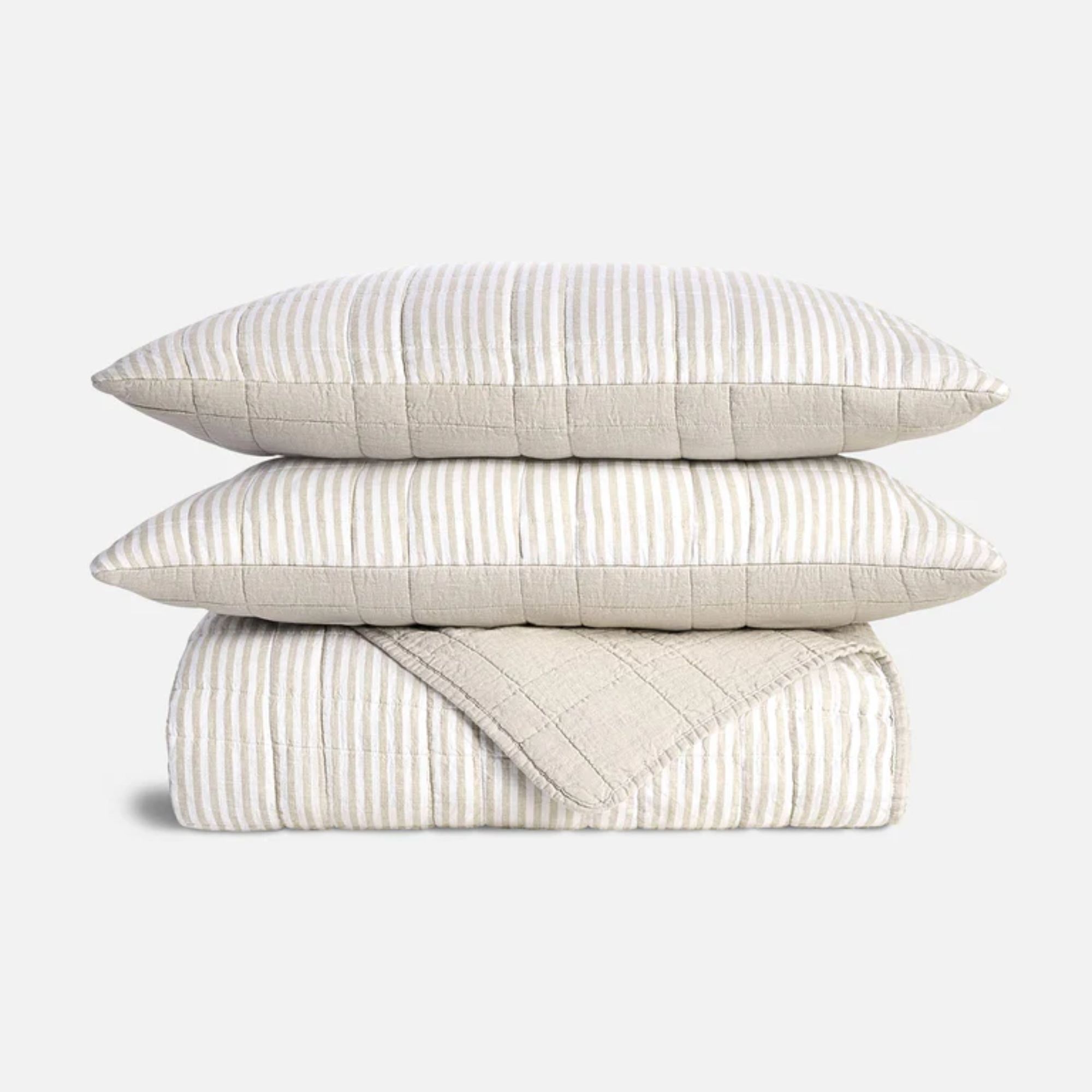 Cream and white striped quilt and pillow set