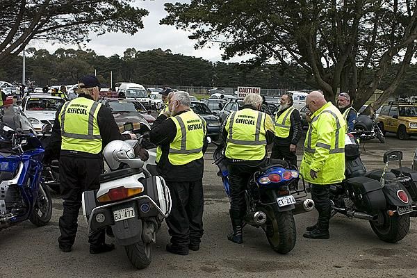 Tour official scouts and their machines await their orders for the 79.6 kilometre second stage from Lara to the top of the You Yangs.