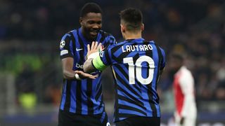 Lautaro Martinez of FC Internazionale celebrates with his team-mate Marcus Thuram in January 2025