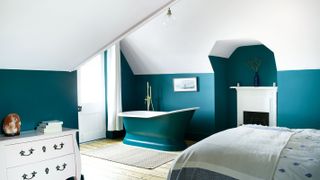loft conversion bedroom with rolltop bath
