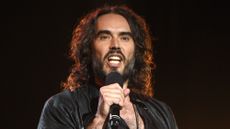 Russell Brand performing on stage