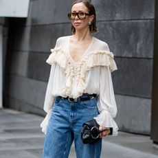 Woman in boho blouse and jeans