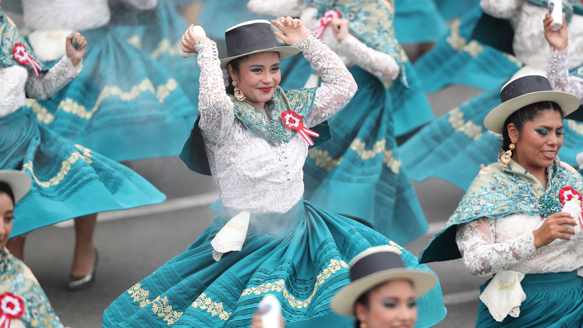 Dancers participate in a parade celebrating the 204th anniversary of Peru's independence in Lima