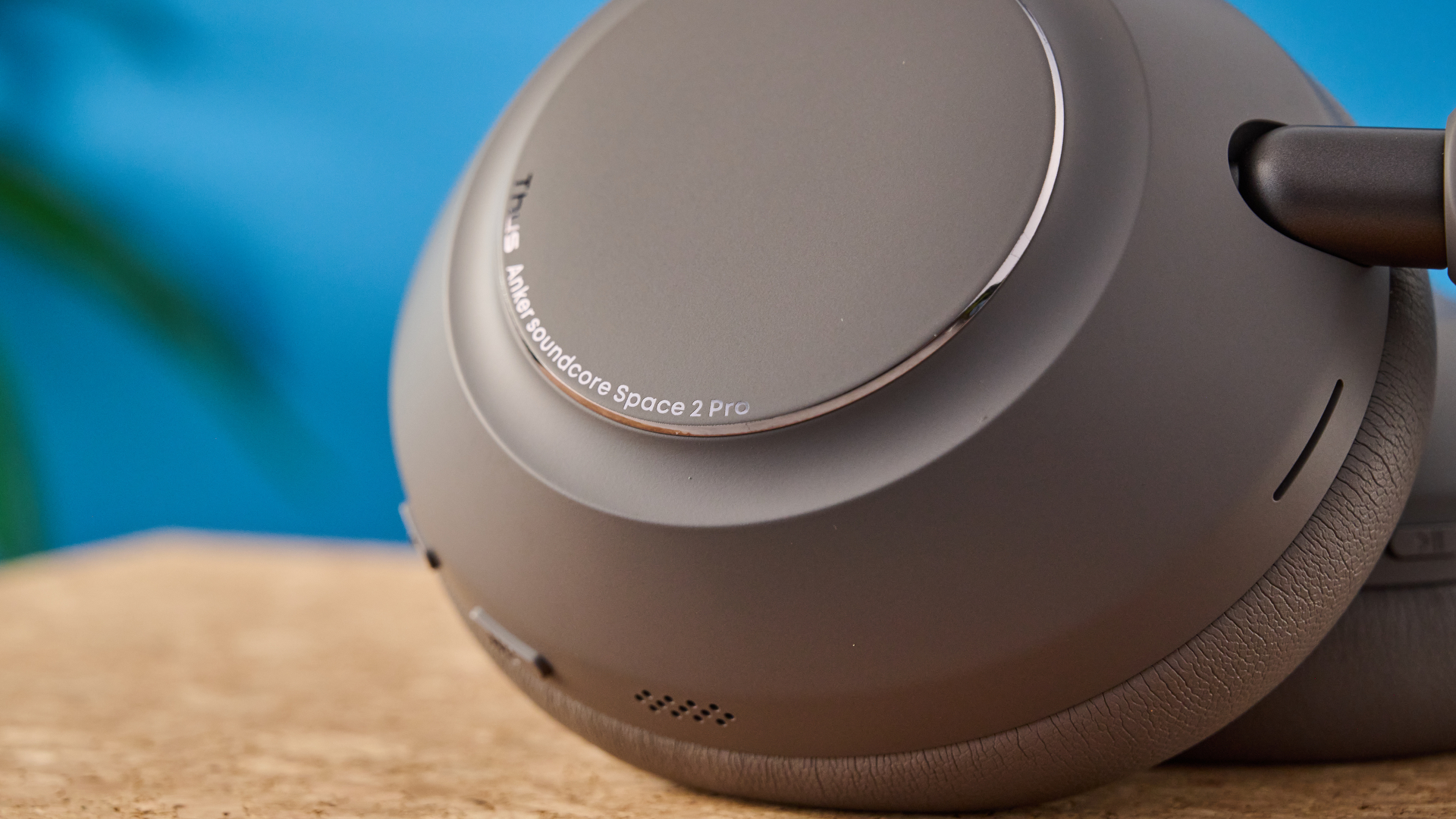 the anker soundcore space 2 pro headphones in mauve gray photographed against a blue tom's guide background
