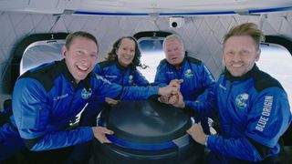 "Star Trek" actor William Shatner (second from right) poses for a photo with his Blue Origin NS-18 crewmates during his record-setting launch into suborbital space at age 90 on Oct. 13, 2021.