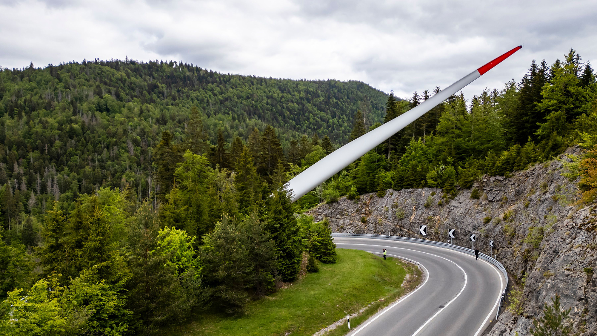 A wind turbine blade is transported through the mountains as part of the construction of the Sur Grati wind farm, near Vallorbe, Switzerland