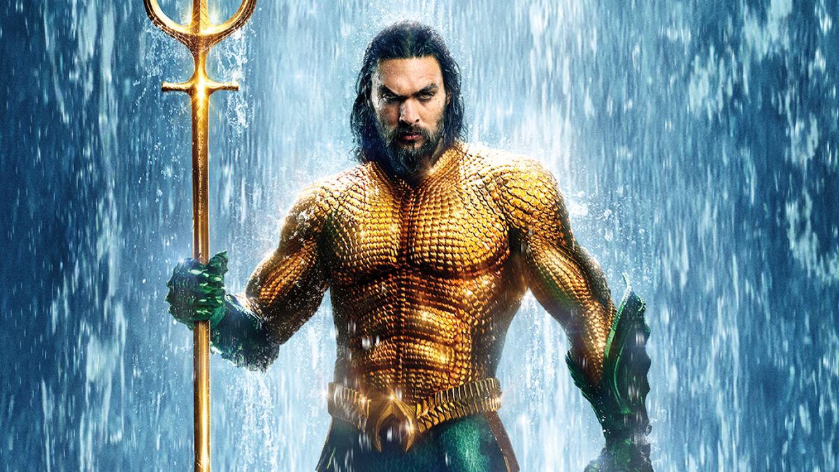 Aquaman in orange and green costume holding trident