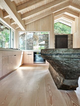 wood kitchen with dark granite island