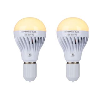 Two white lightbulbs with yellow tops