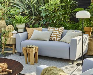Grey outdoor sofa with yellow cushions