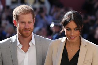 Prince Harry, Duke of Sussex and Meghan, Duchess of Sussex arrive for an engagement at Edes House during an official visit to Sussex