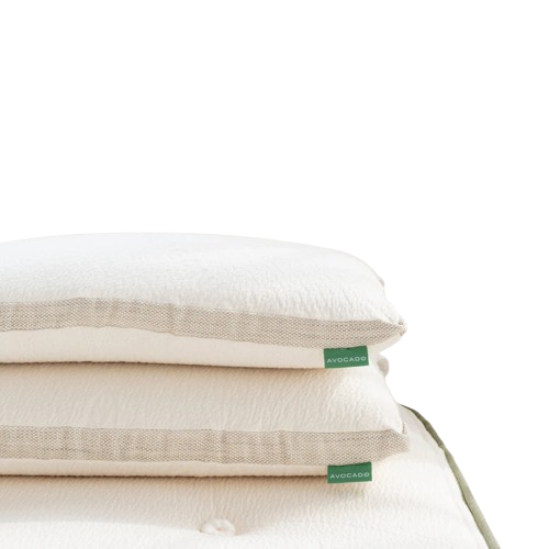 Avocado Molded Latex Pillows stacked against a white background on the bed