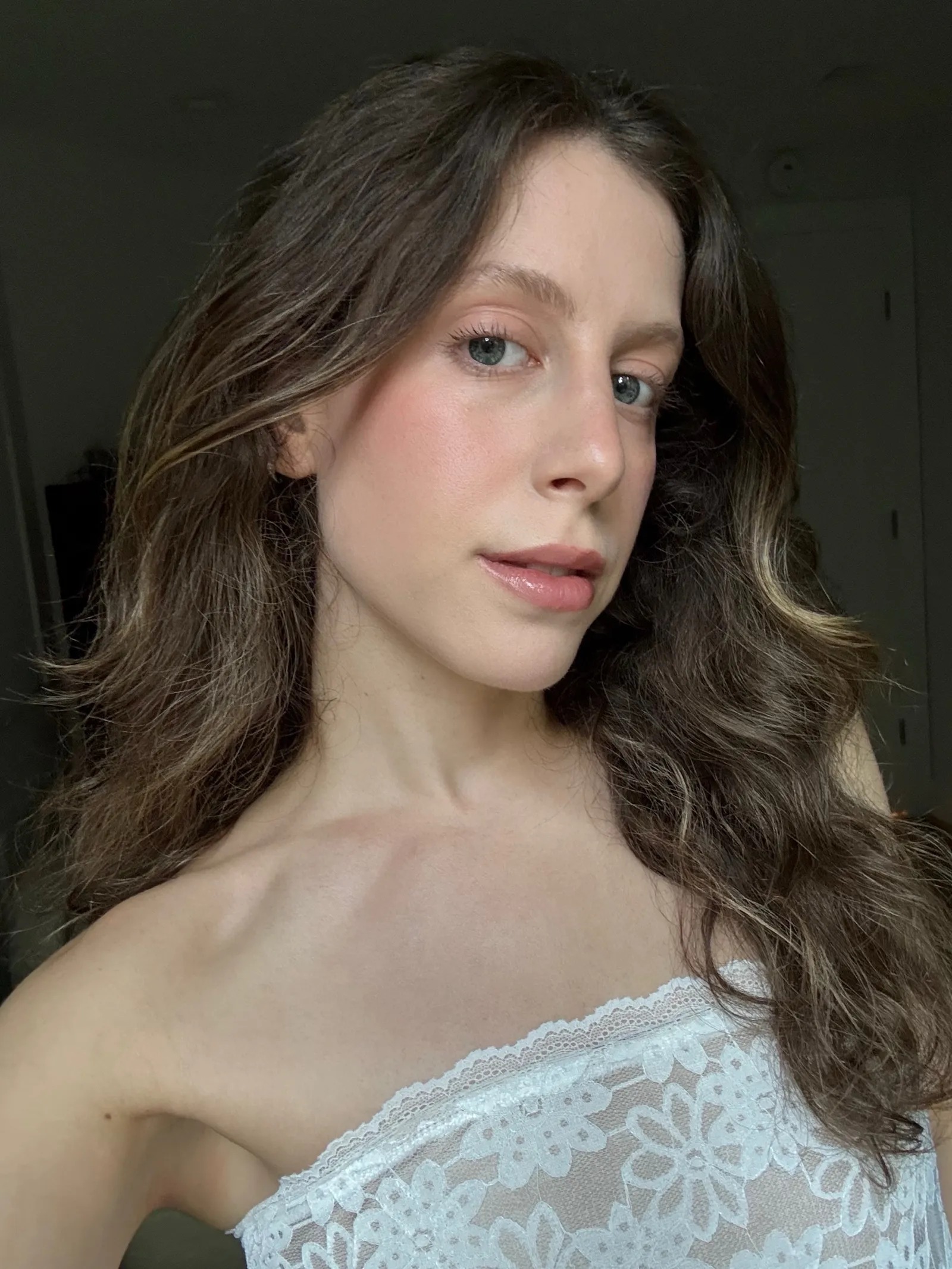 Schneider wearing the Outside In Silk Serum Foundation.