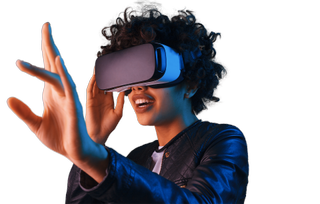 A student wearing virtual reality goggles lifts one arm in front of her seemingly to touch something she sees in an virtual environment