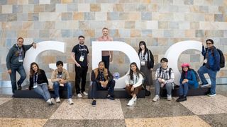 Game developers gather around giant GDC letters outside the Moscone Centre in San Francisco