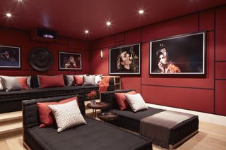 home cinema with red walls and red sofas