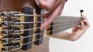 Best 5-sting bass guitars: Person playing a five-string bass