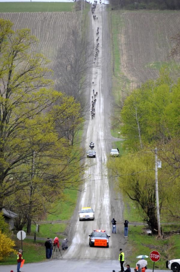 The peloton hammers down Meetinghouse Road, the seventh of eight dirt sections on the 100km circuit