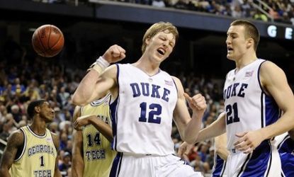 Duke players Kyle Singer and Miles Plumlee celebrate a win.