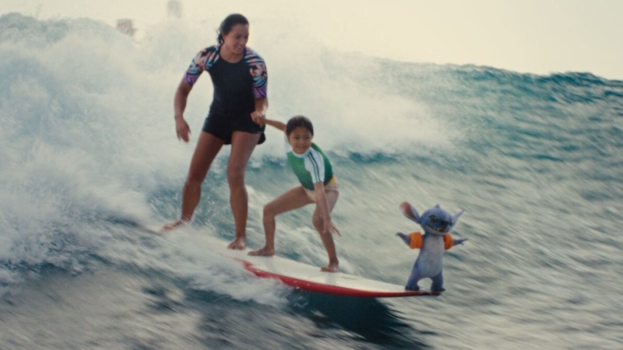 Nani, Lilo &amp; Stitch on a surfboard catching a wave in 2025 live-action movie