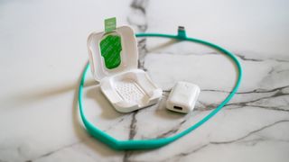 Upright Go 2 posture corrector on a marble table