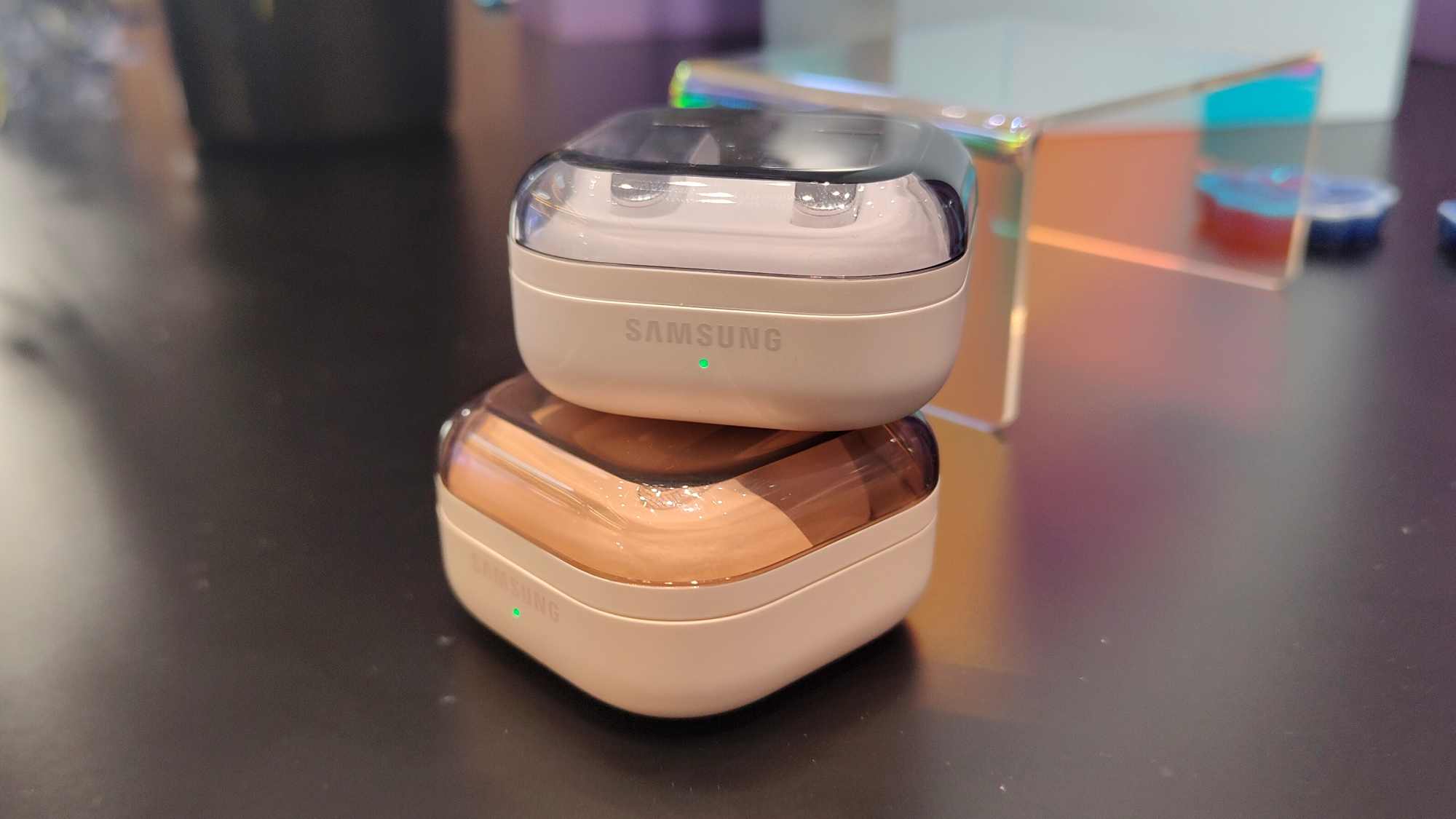 The Samsung Galaxy Buds 4 and Buds 4 Pro cases, stacked on top of one another.