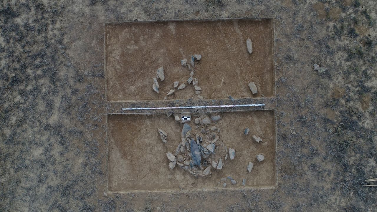 An aerial view of a square excavation site