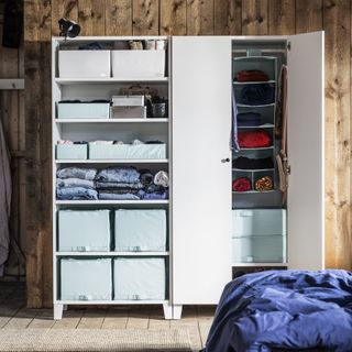 white wardrobes with doors and on view storage boxes