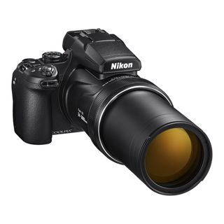 Nikon Coolpix P1000 with zoom lens extended on a white background.
