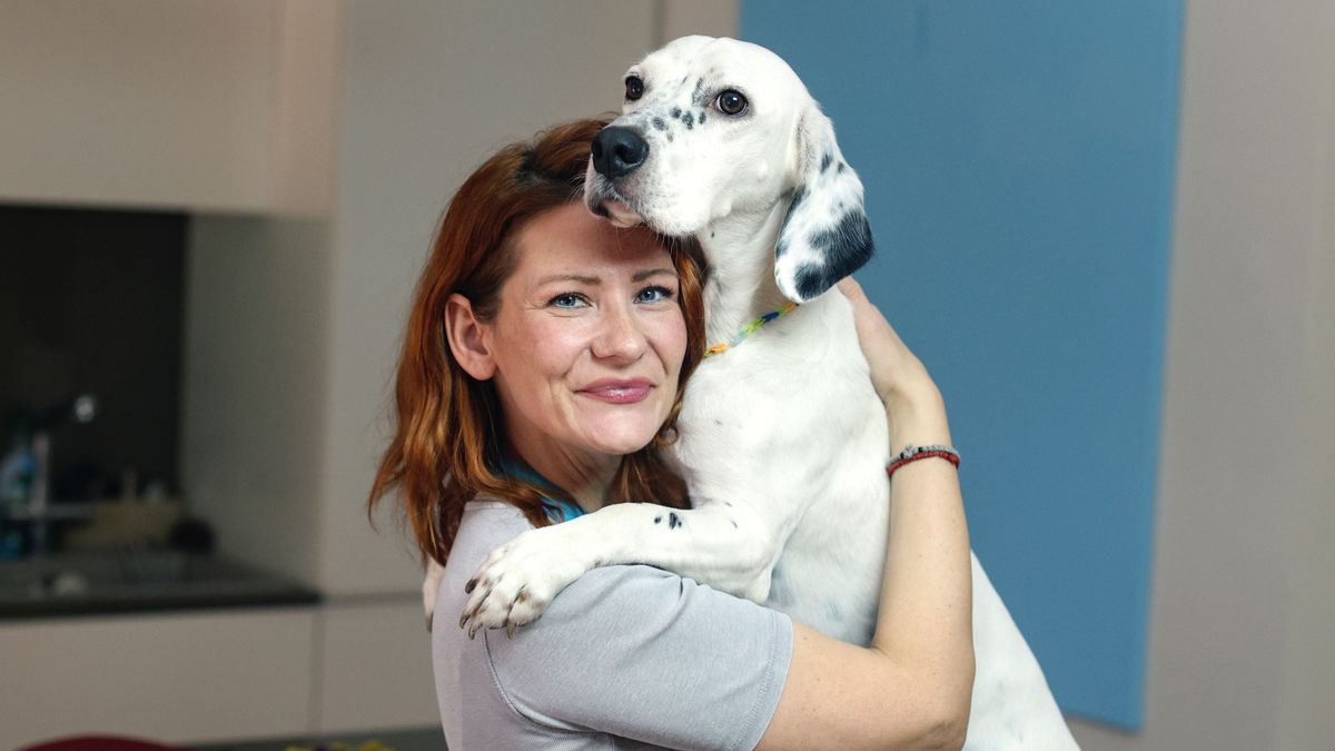 Woman hugging dog