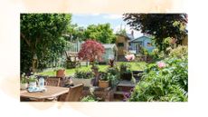 picture of garden with steps, furniture and out buidlings 