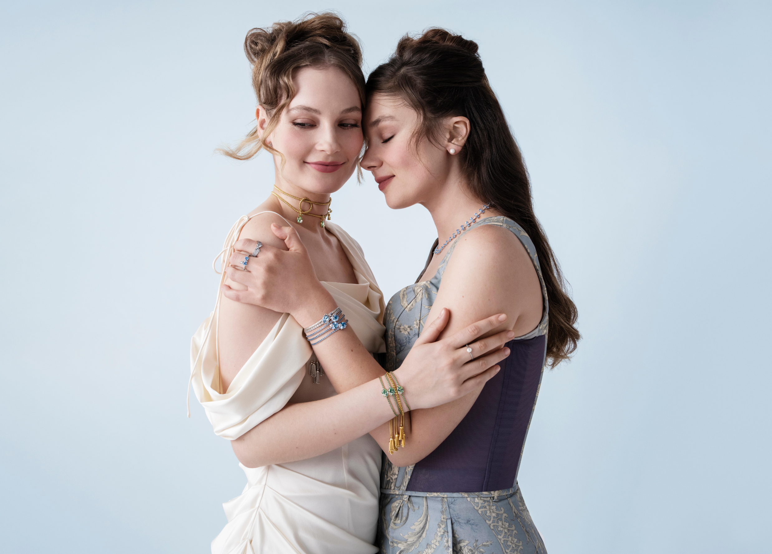 Bridgerton actresses Hannah Dodd and Claudia Jessie wearing jewelry from the Pandora x 'Bridgerton' collection.