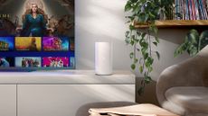 Sky's Gigafast+ Hub on a TV stand in a living room