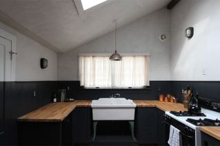 A black and white U shaped Shaker kitchen