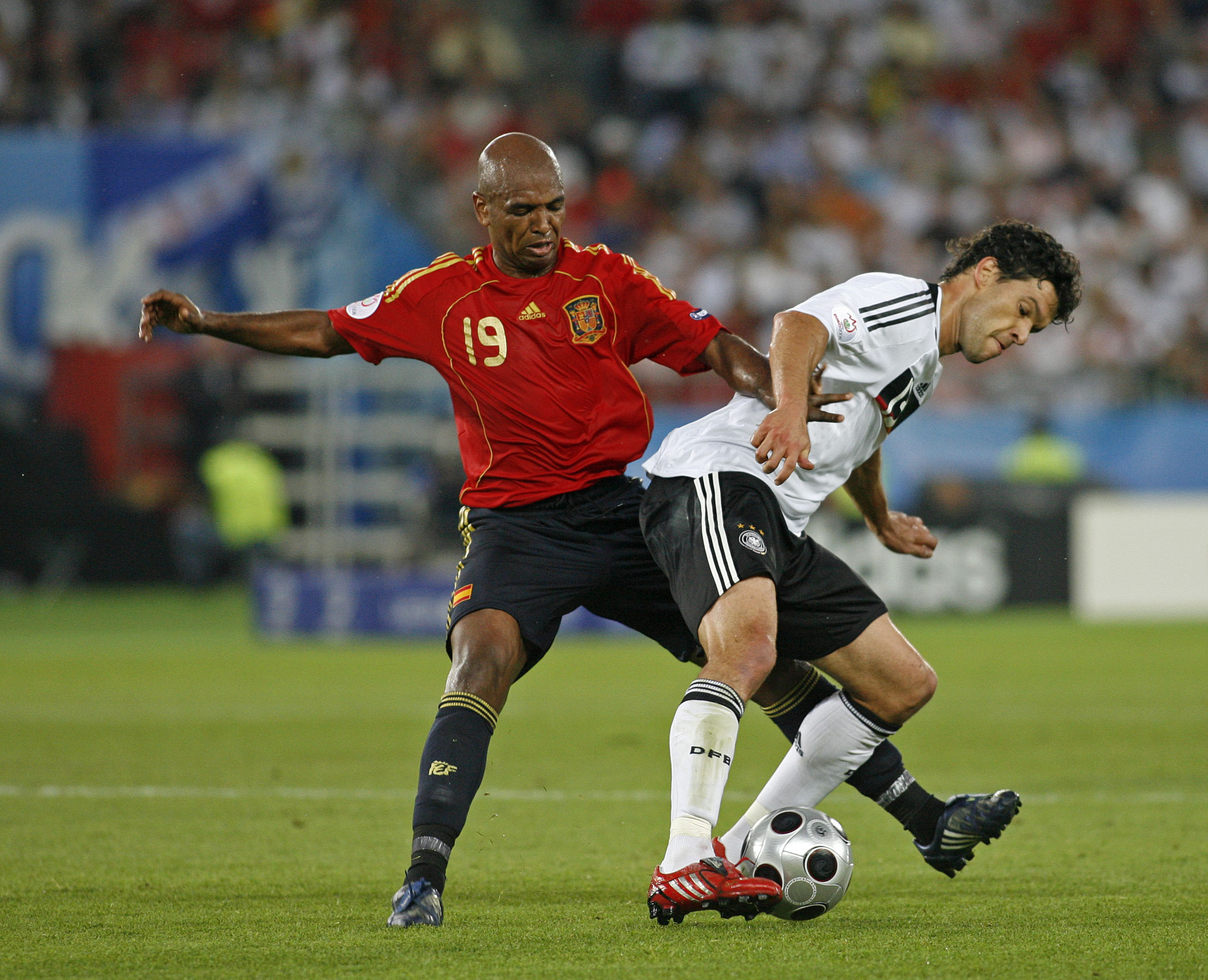 Spain's Marcos Senna challenges Germany's Michael Ballack in the Euro 2008 final.